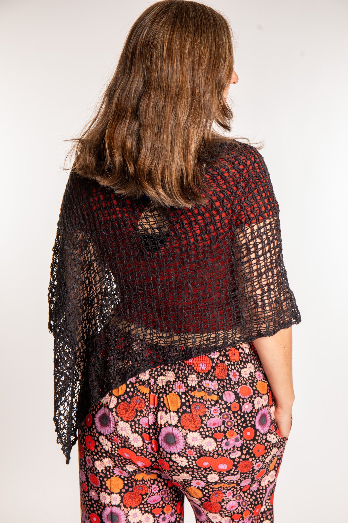 Molly is wearing the Black loose weave shawl