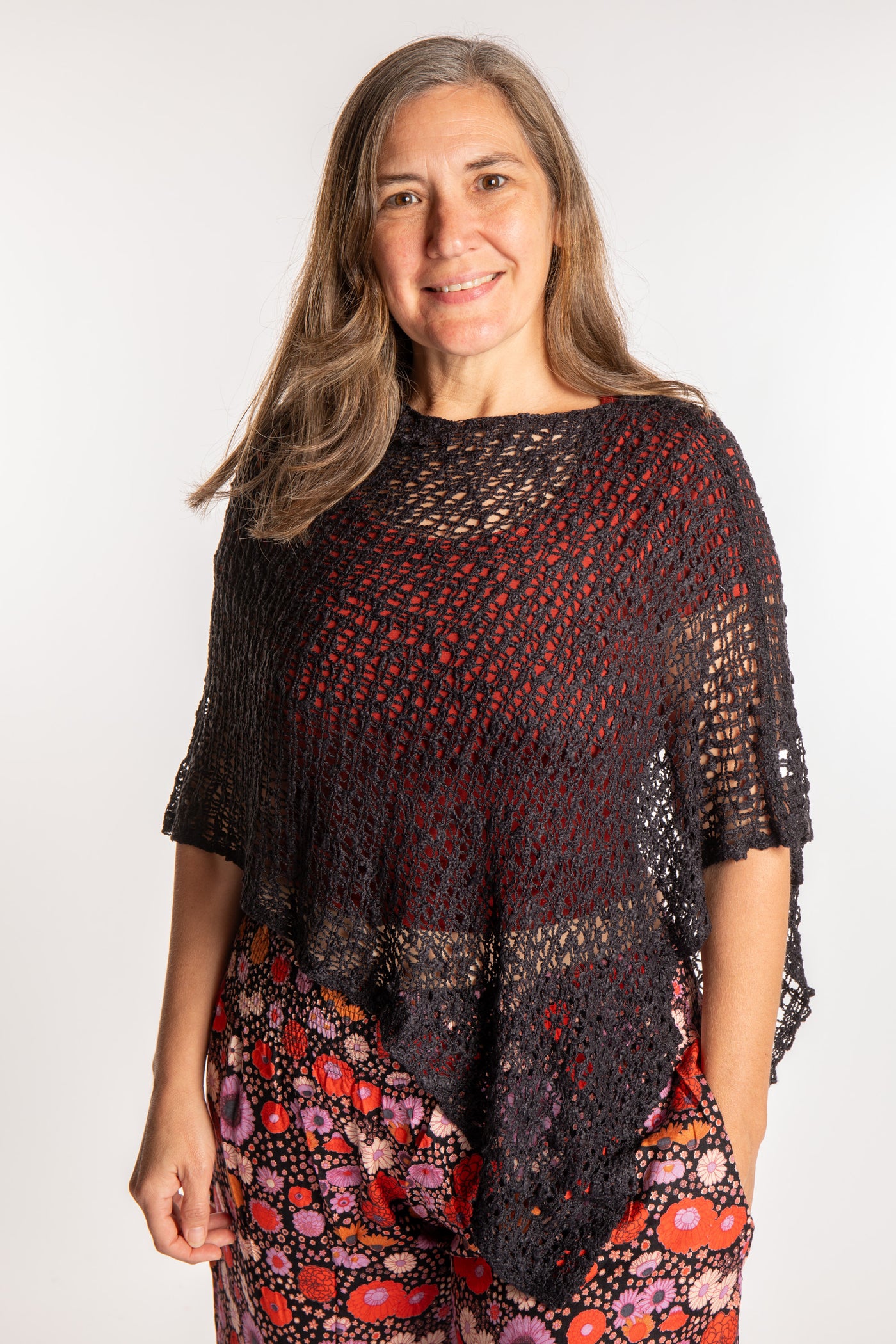 Molly is wearing the Black loose weave shawl