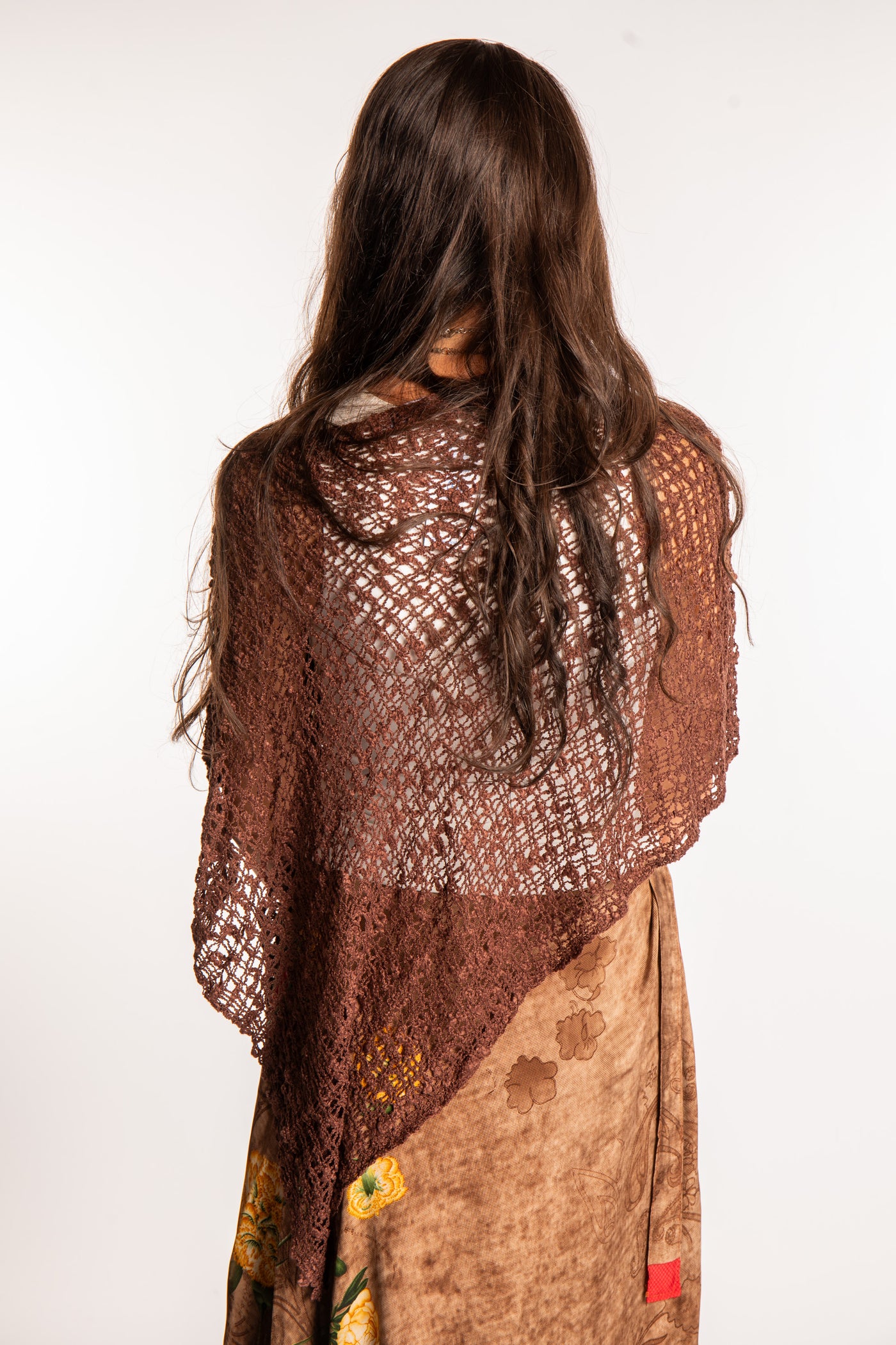 Jen is wearing the Brown loose weave shawl