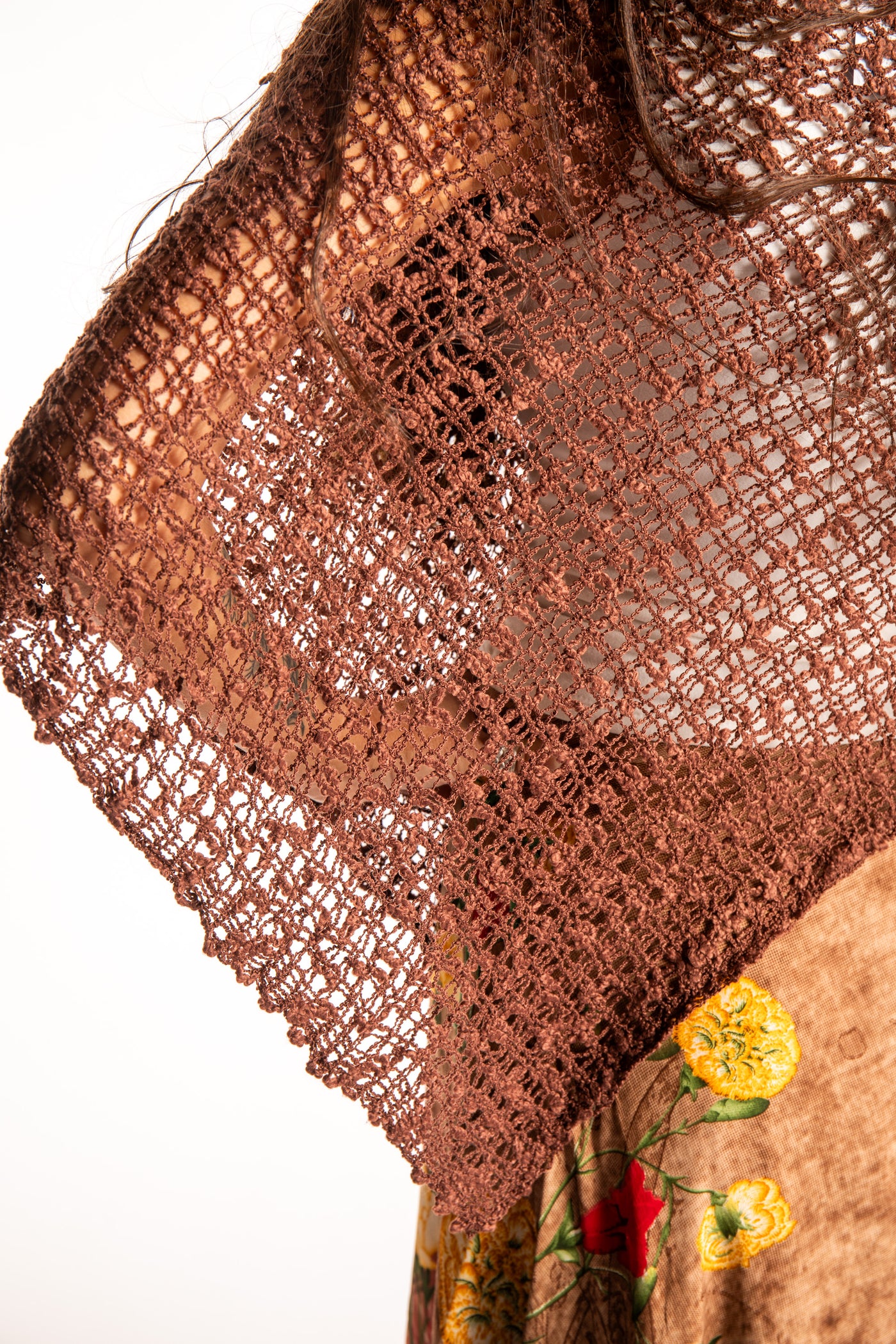 Jen is wearing the Brown loose weave shawl