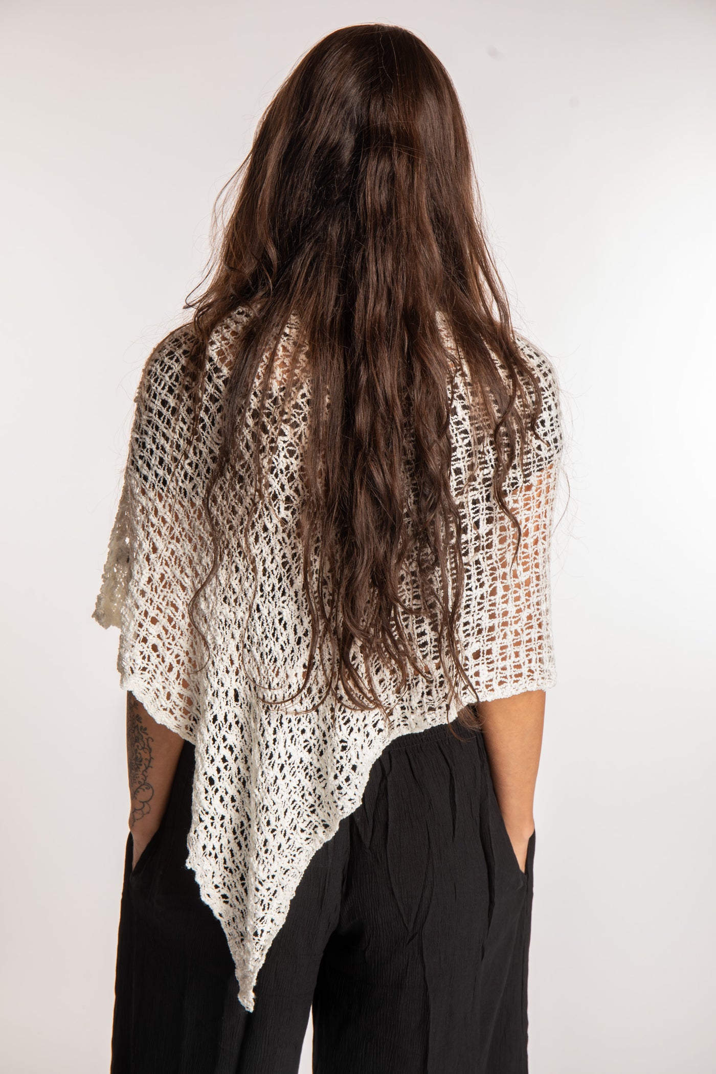 Jen is wearing the Ivory loose weave shawl