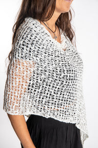 Jen is wearing the Ivory loose weave shawl