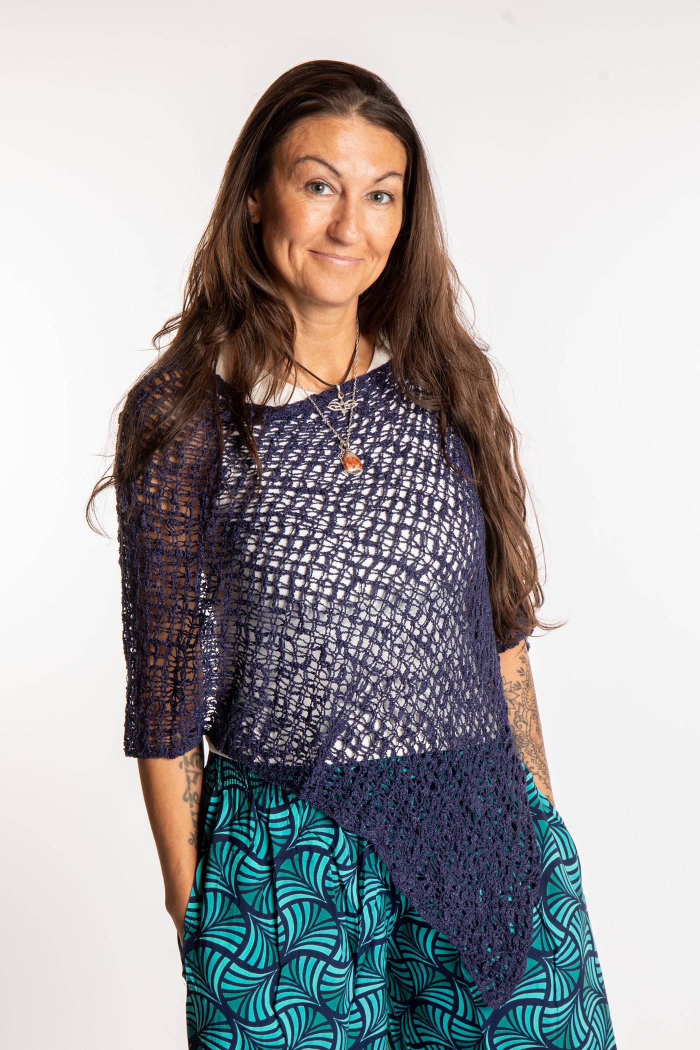 Jen is wearing the Navy loose weave shawl