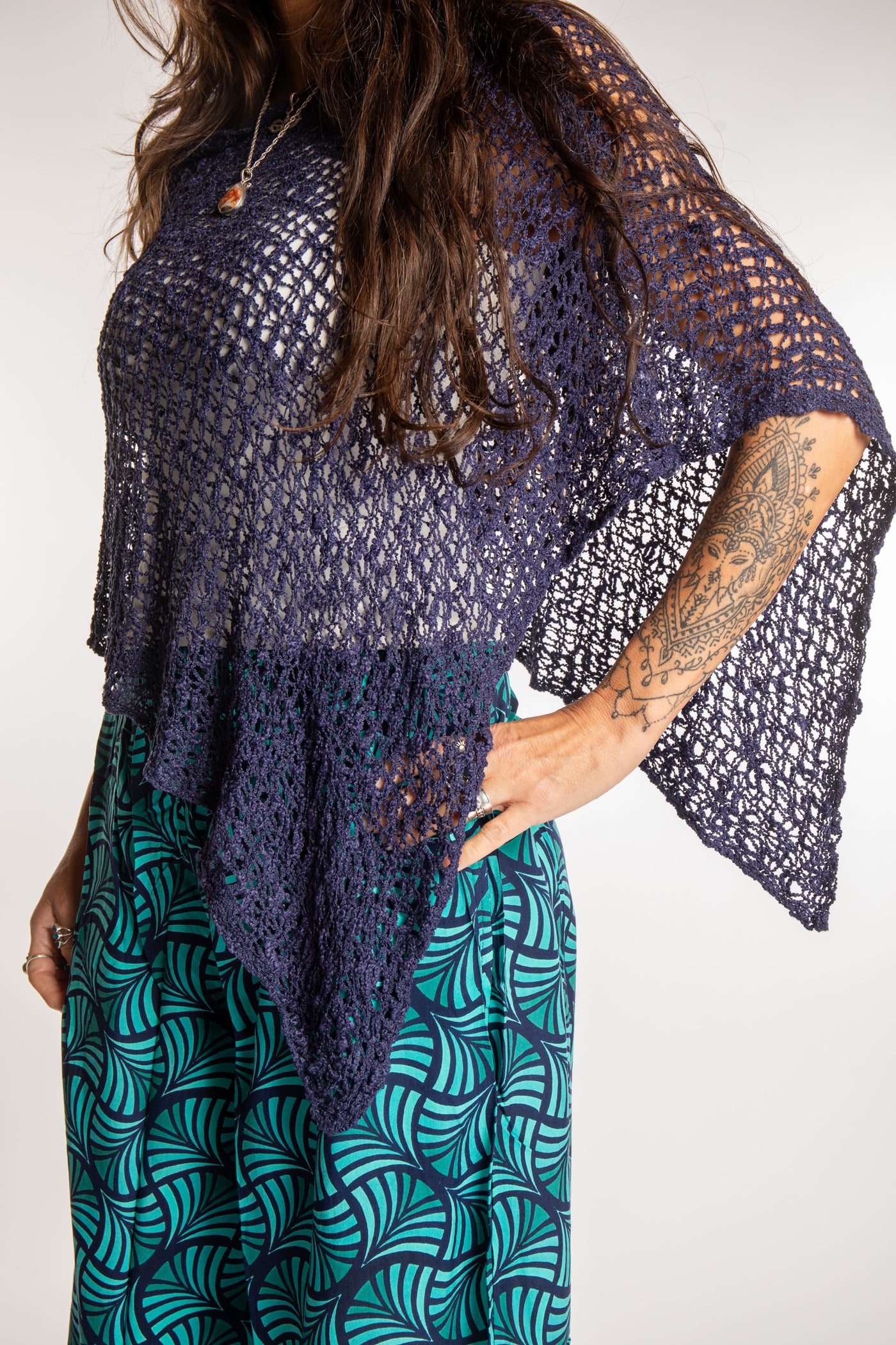 Jen is wearing the Navy loose weave shawl