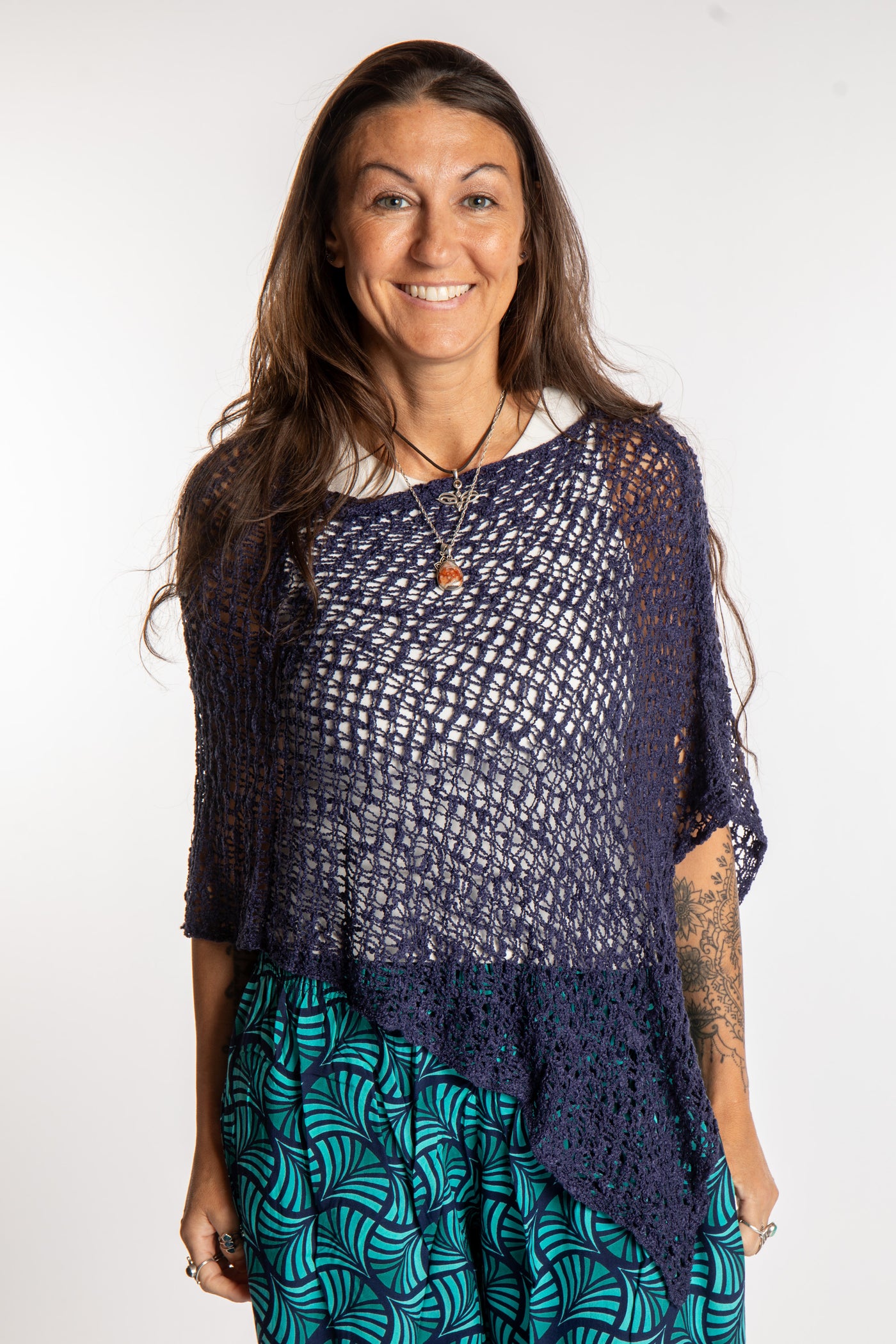 Jen is wearing the Navy loose weave shawl