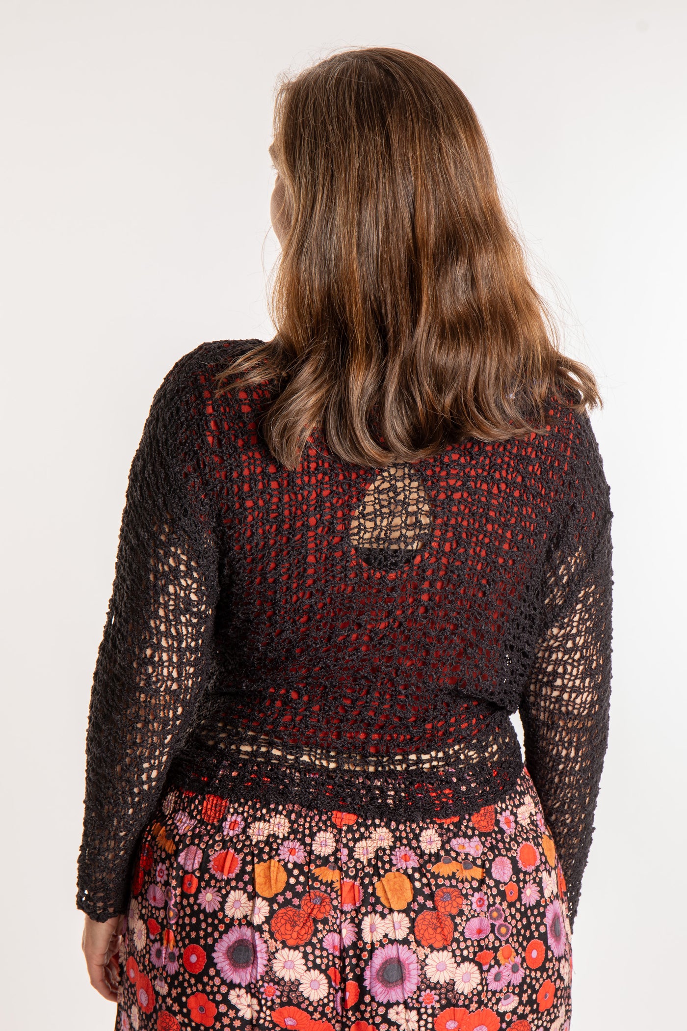 Holly is wearing the Black loose knit cardigan
