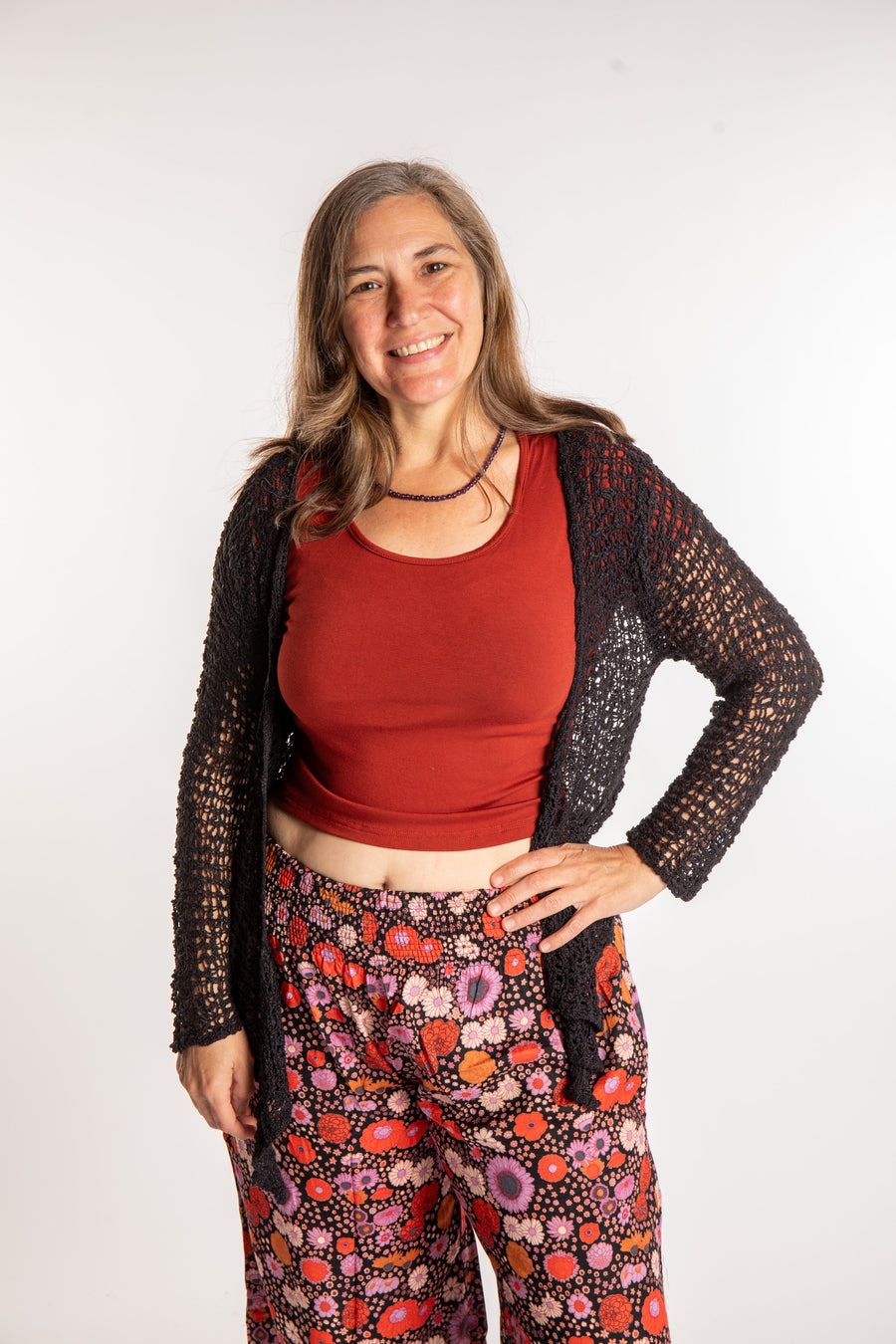 Holly is wearing the Black loose knit cardigan