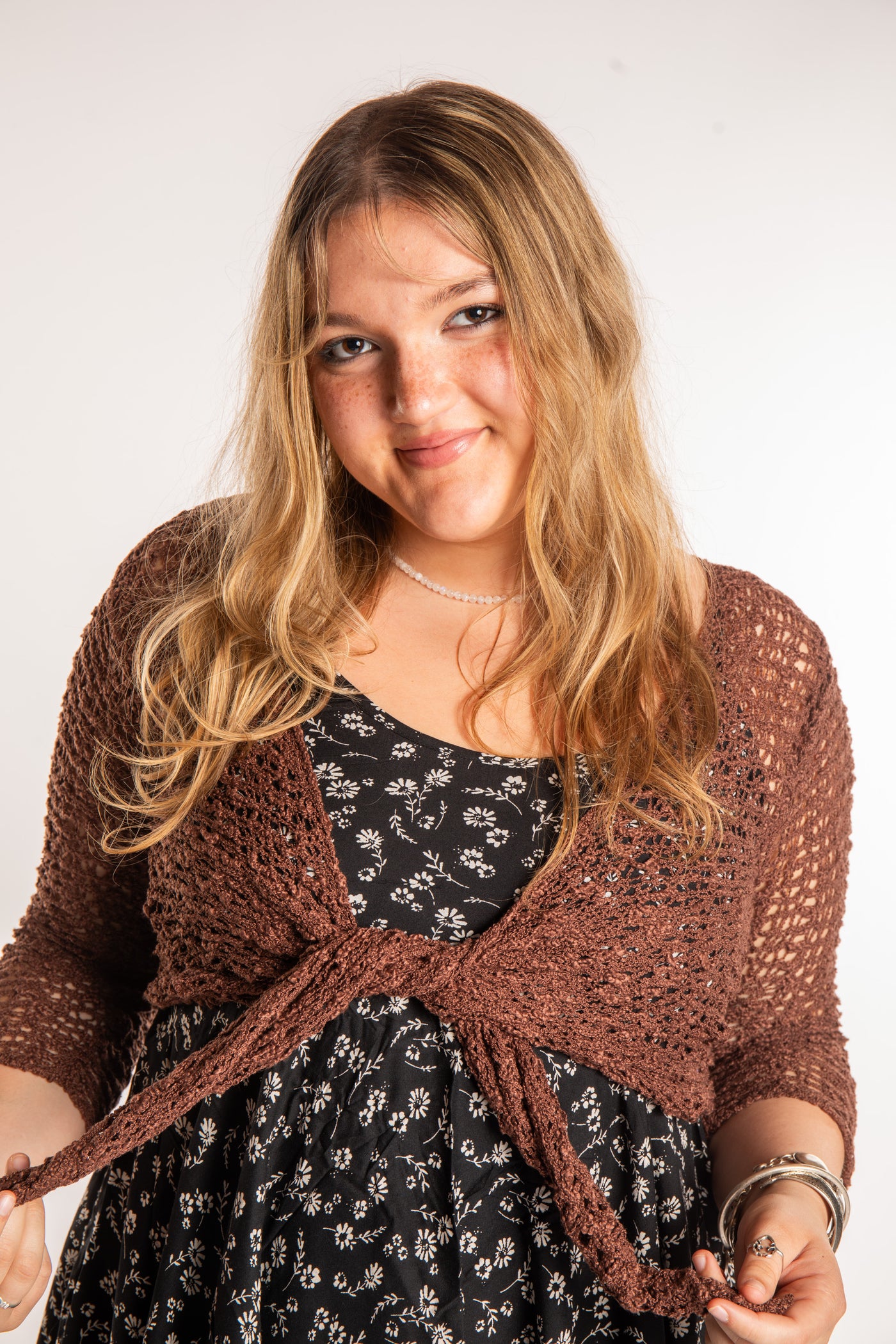 Emma is wearing the Brown loose knit cardigan