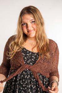 Emma is wearing the Brown loose knit cardigan