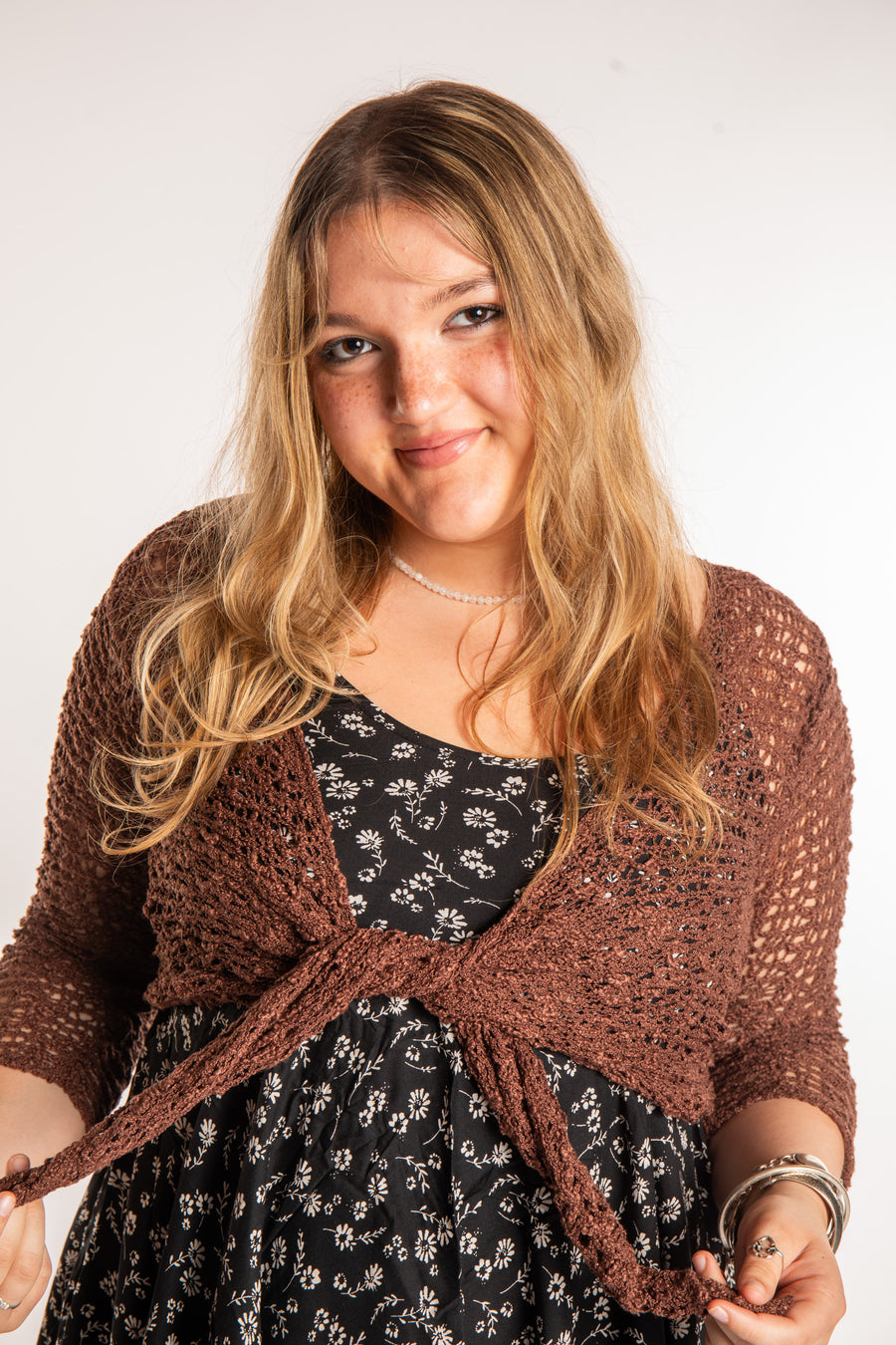 Emma is wearing the Brown loose knit cardigan