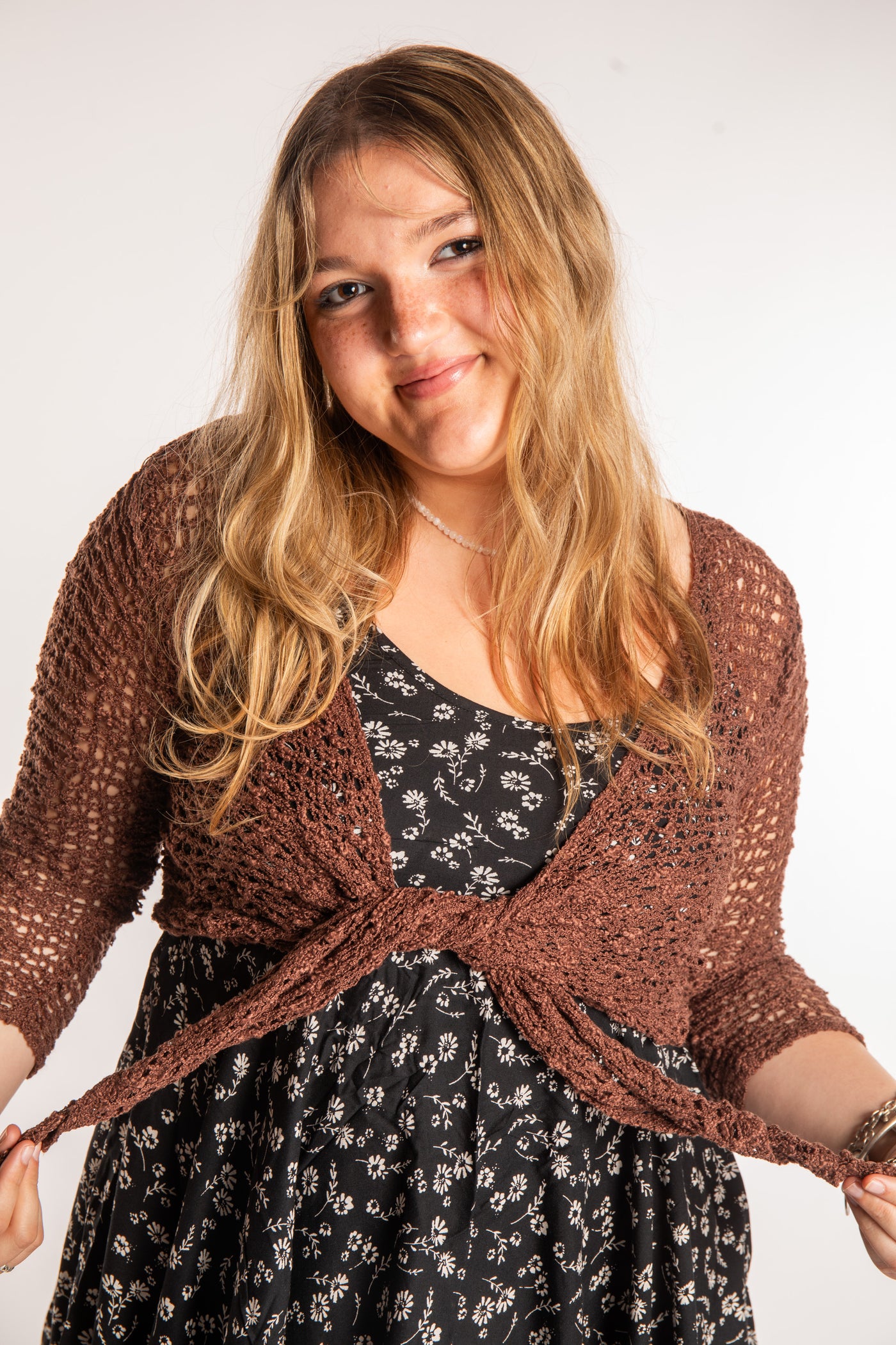 Emma is wearing the Brown loose knit cardigan