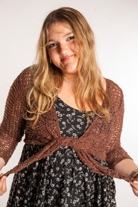 Emma is wearing the Brown loose knit cardigan