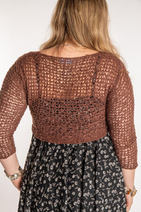 Emma is wearing the Brown loose knit cardigan