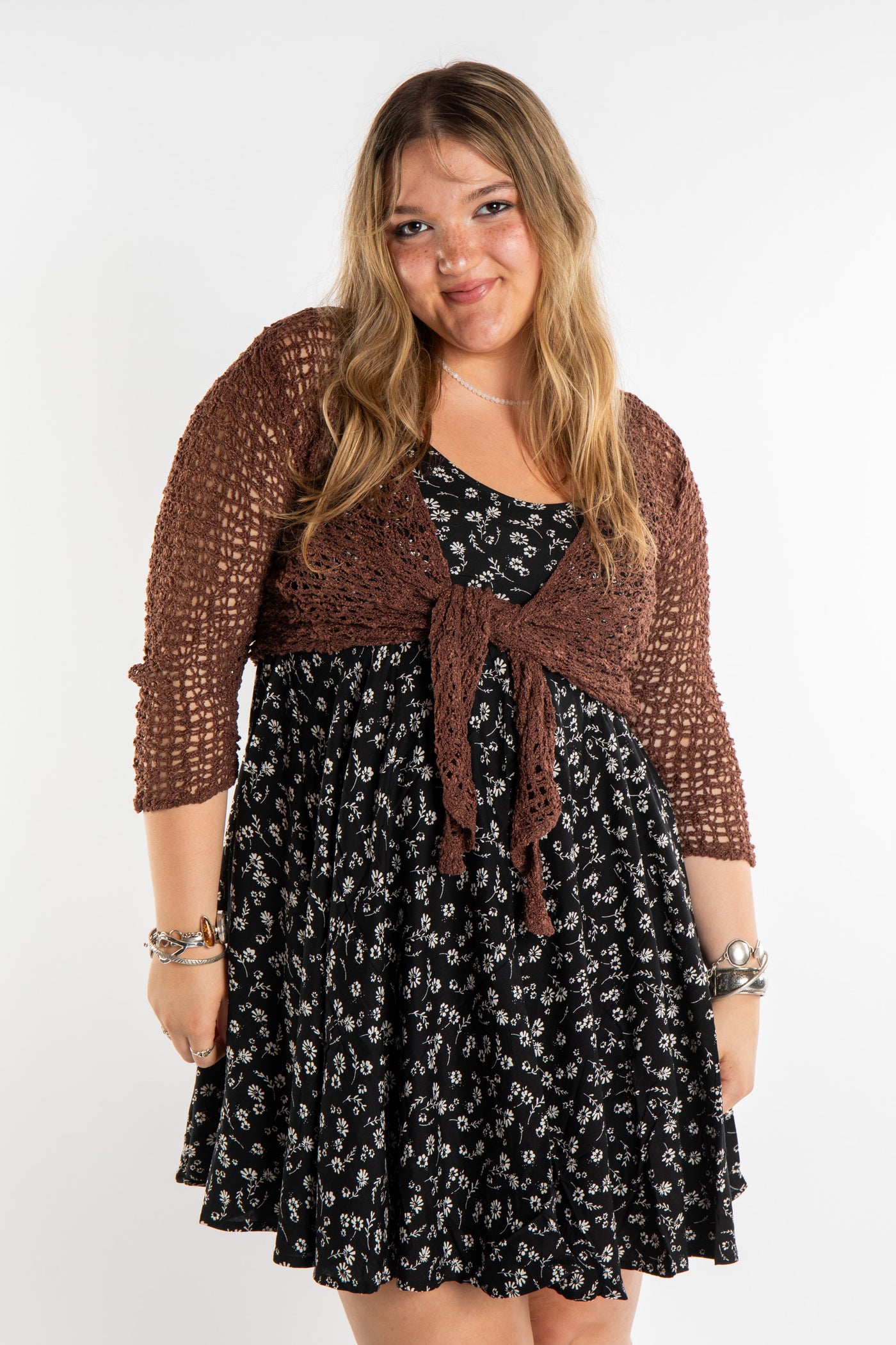 Emma is wearing the Brown loose knit cardigan