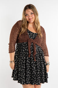 Emma is wearing the Brown loose knit cardigan