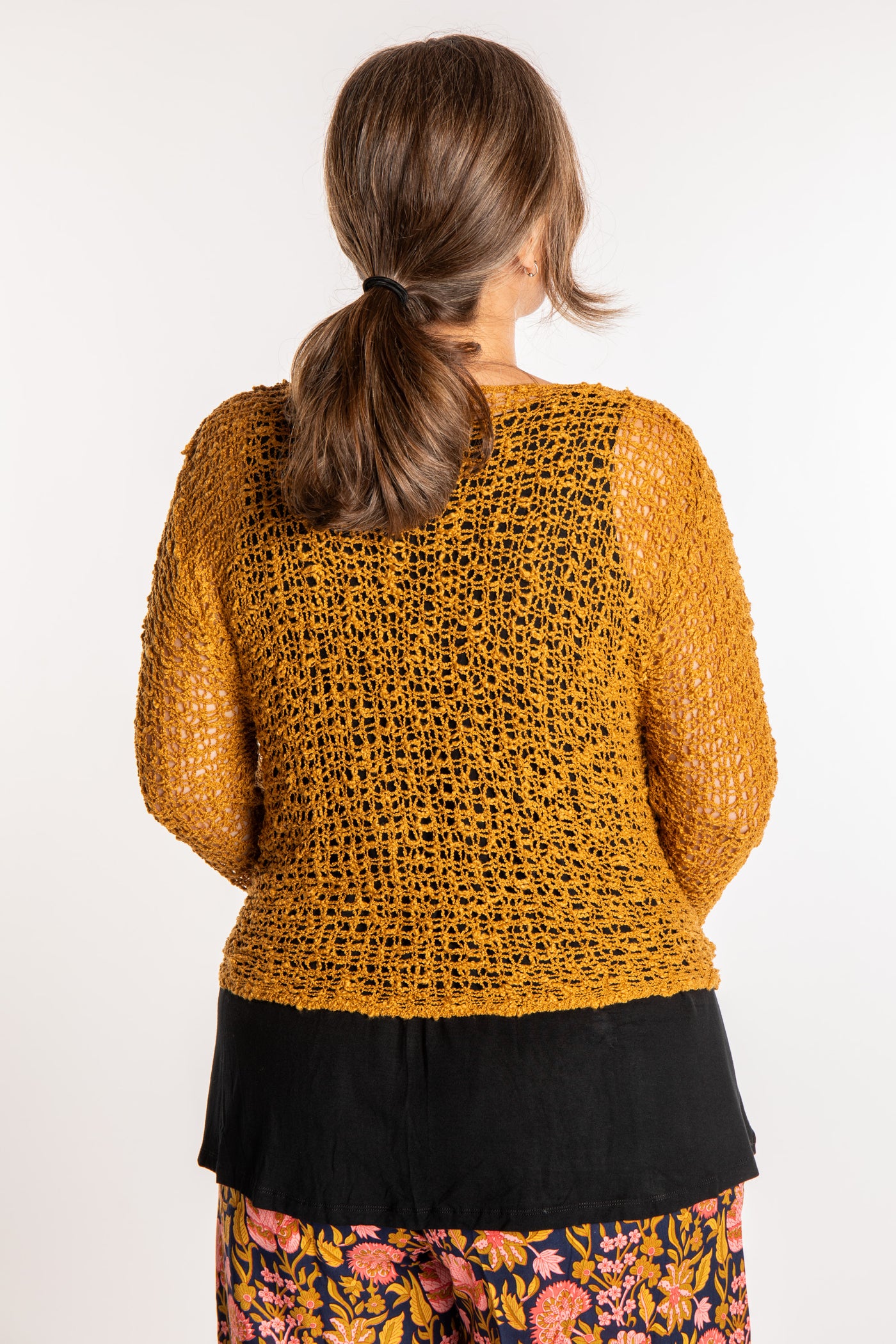 Holly is wearing the Ochre loose knit cardigan