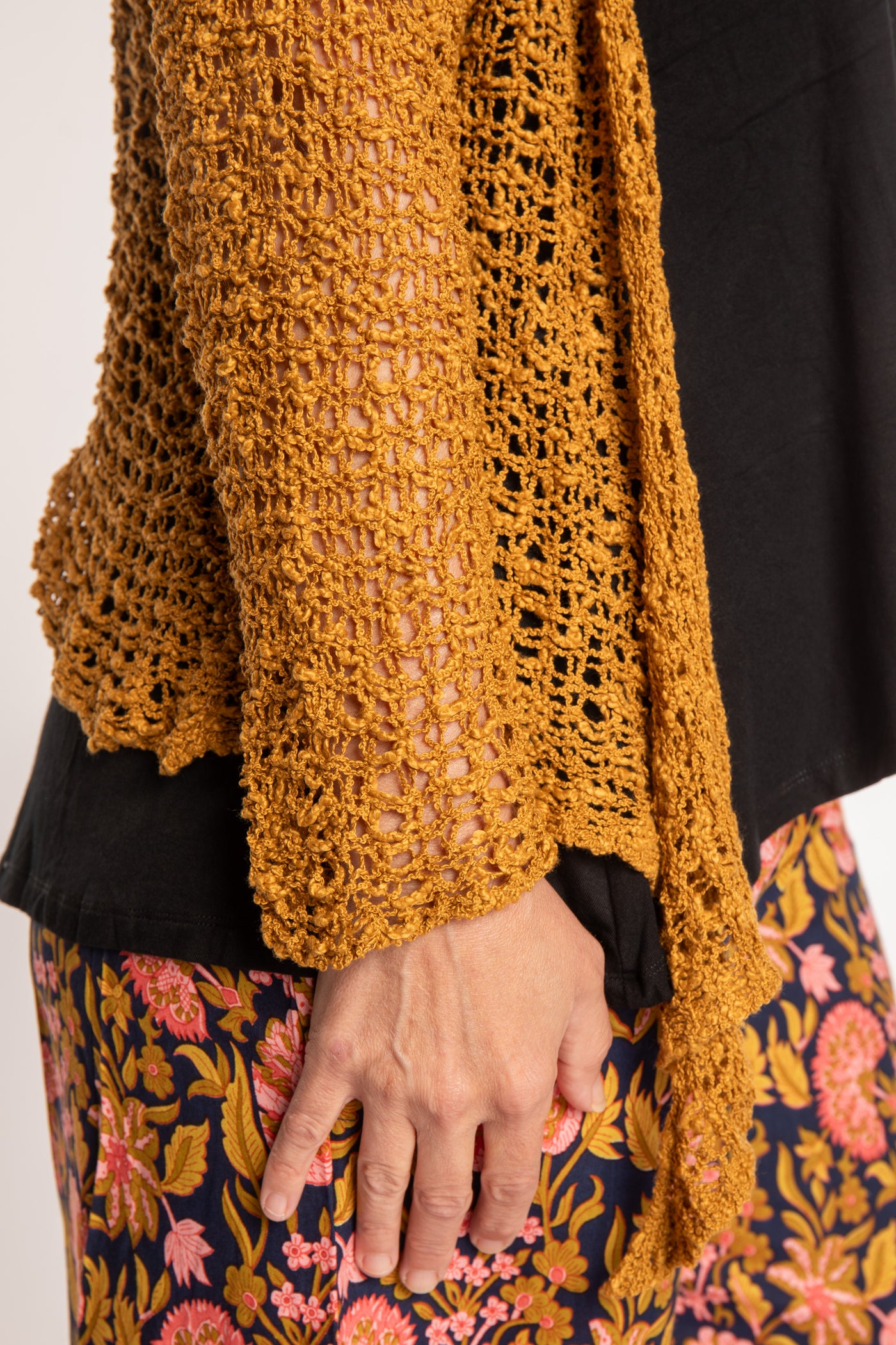 Holly is wearing the Ochre loose knit cardigan