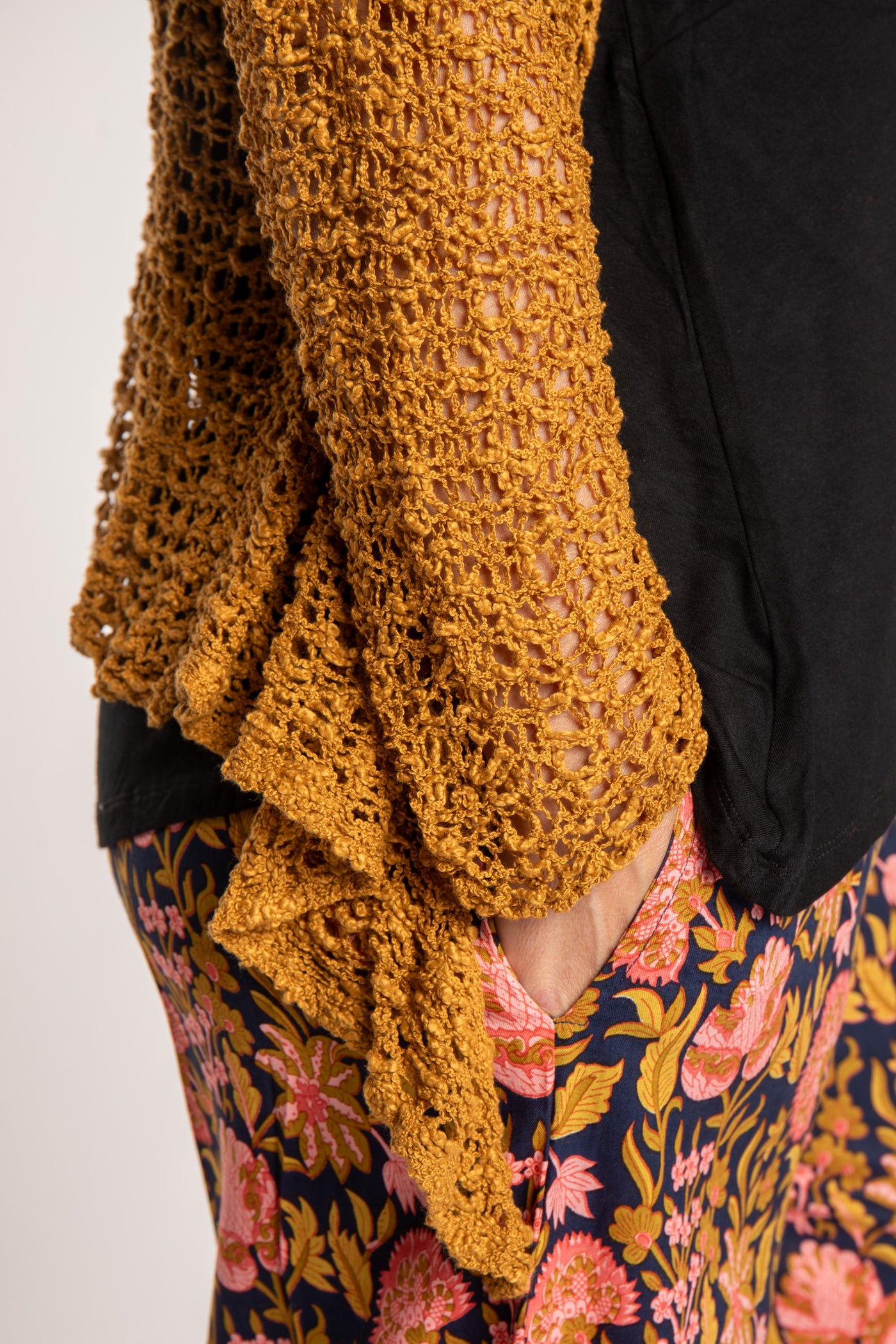 Holly is wearing the Ochre loose knit cardigan