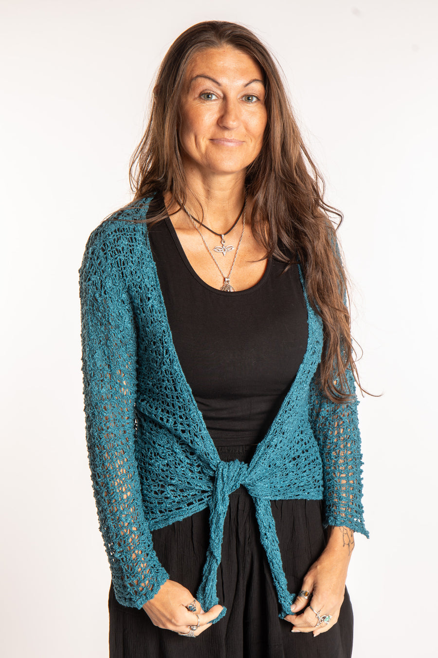 Jen is wearing the Teal loose knit cardigan