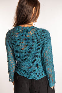 Jen is wearing the Teal loose knit cardigan