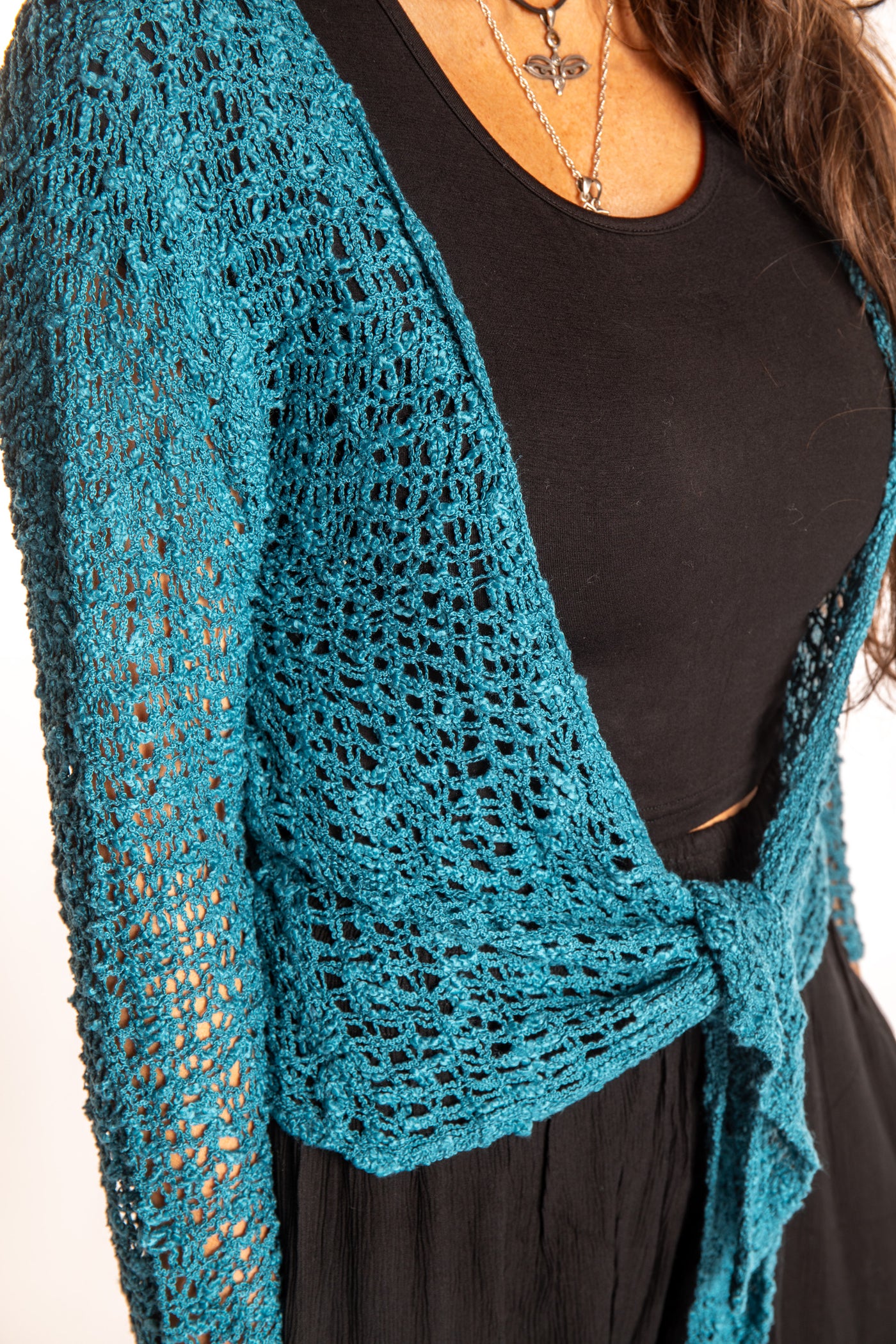 Jen is wearing the Teal loose knit cardigan