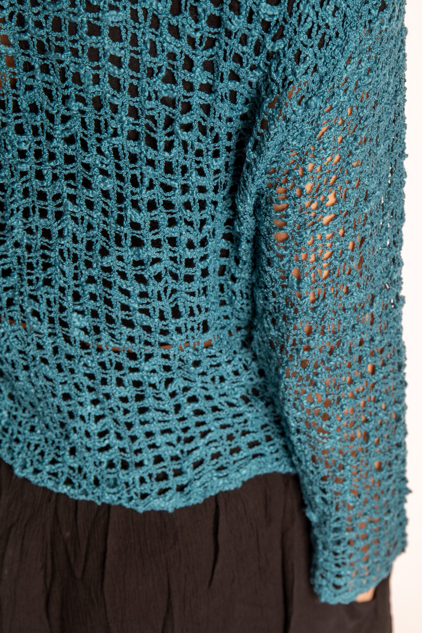 Jen is wearing the Teal loose knit cardigan