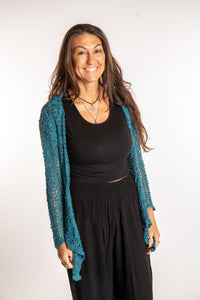 Jen is wearing the Teal loose knit cardigan