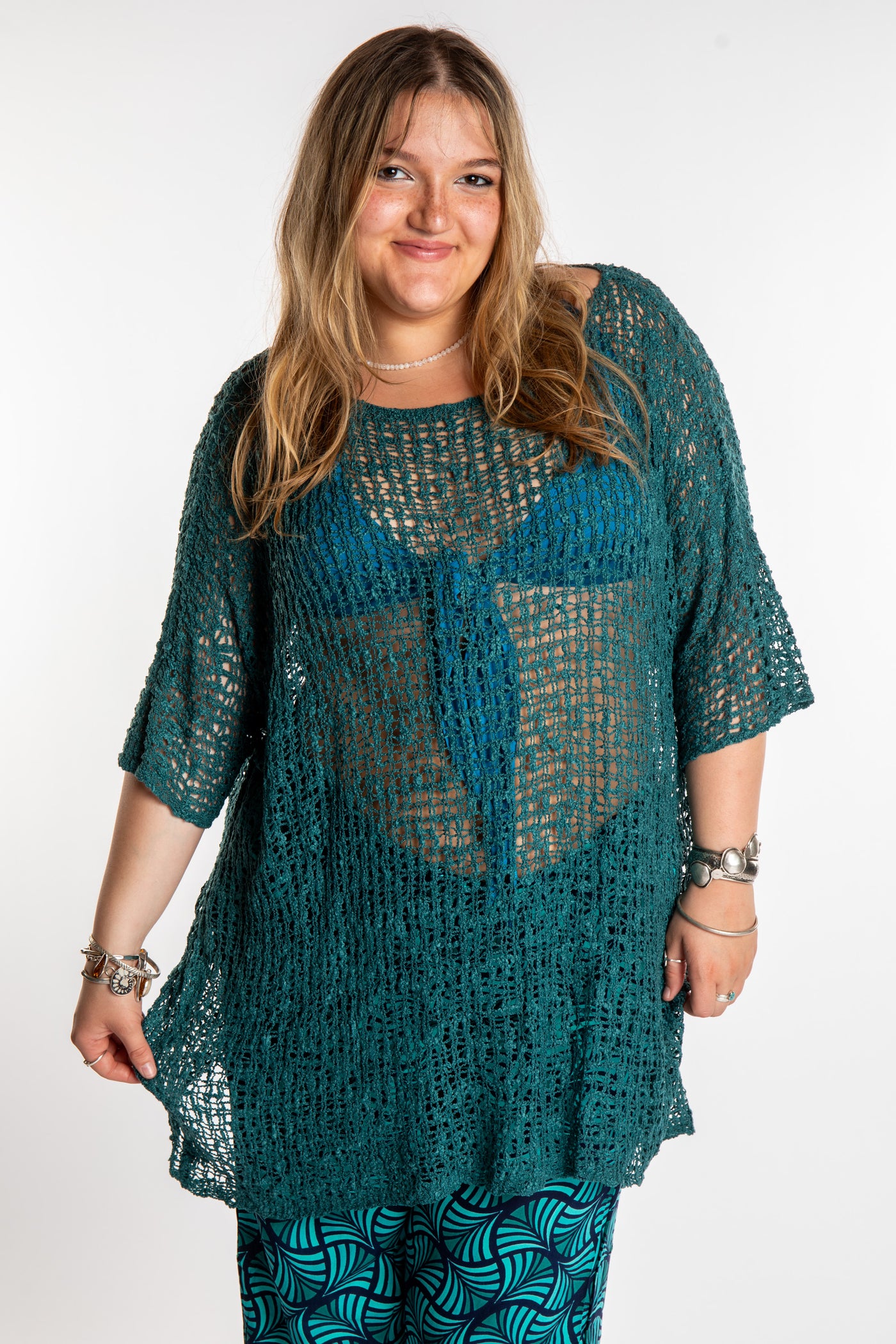 Emma is wearing the Aquamarine loose knit cover up