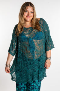 Emma is wearing the Aquamarine loose knit cover up