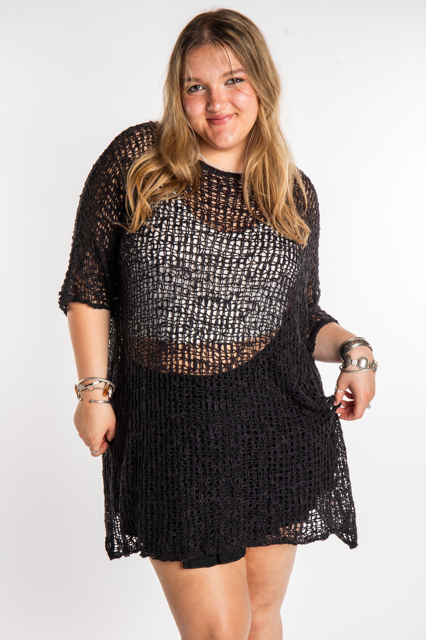 Emma is wearing the Black loose knit cover up