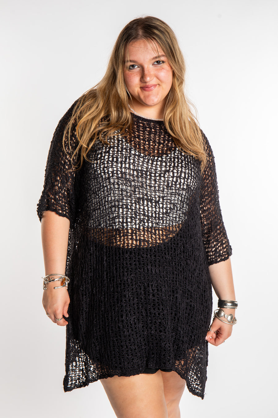 Emma is wearing the Black loose knit cover up