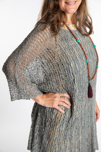 Holly is wearing the Gray loose knit cover up