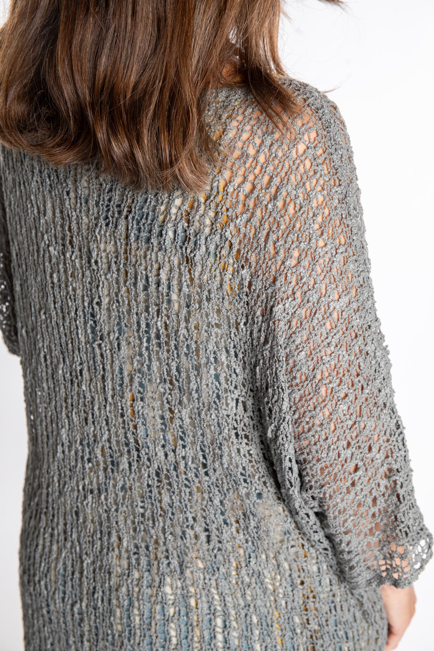 Holly is wearing the Gray loose knit cover up