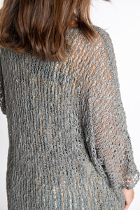 Holly is wearing the Gray loose knit cover up