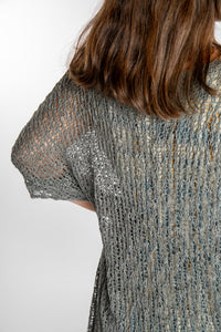 Holly is wearing the Gray loose knit cover up