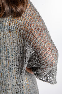Holly is wearing the Gray loose knit cover up