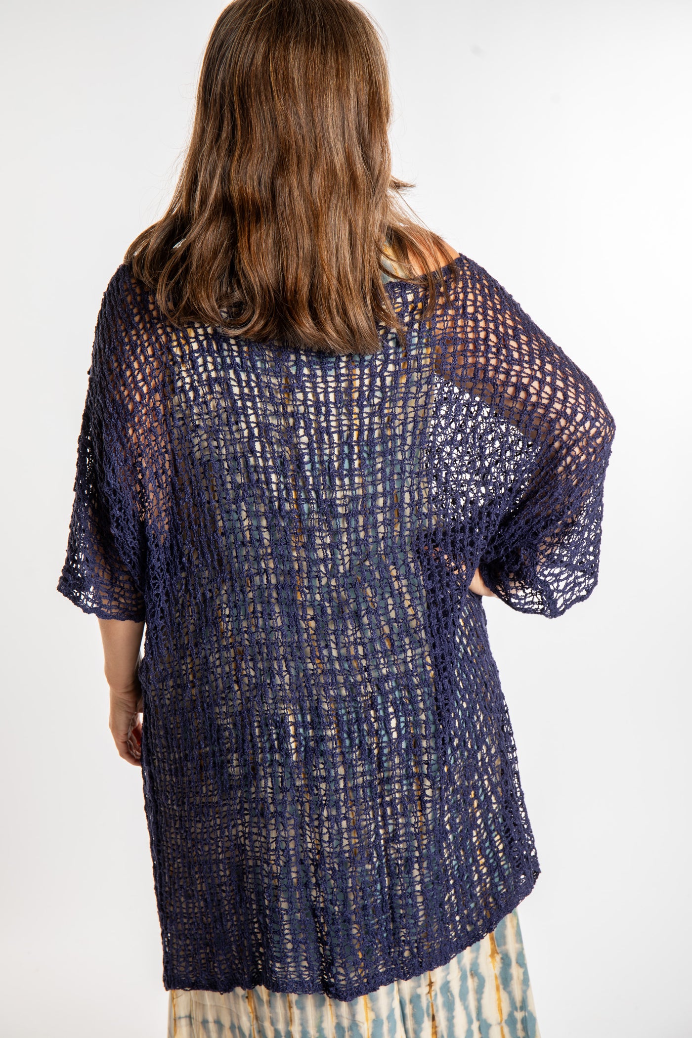 Holly is wearing the Navy loose knit cover up