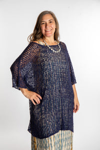 Holly is wearing the Navy loose knit cover up