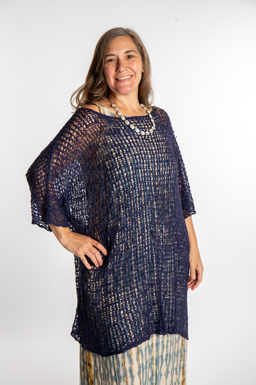 Holly is wearing the Navy loose knit cover up