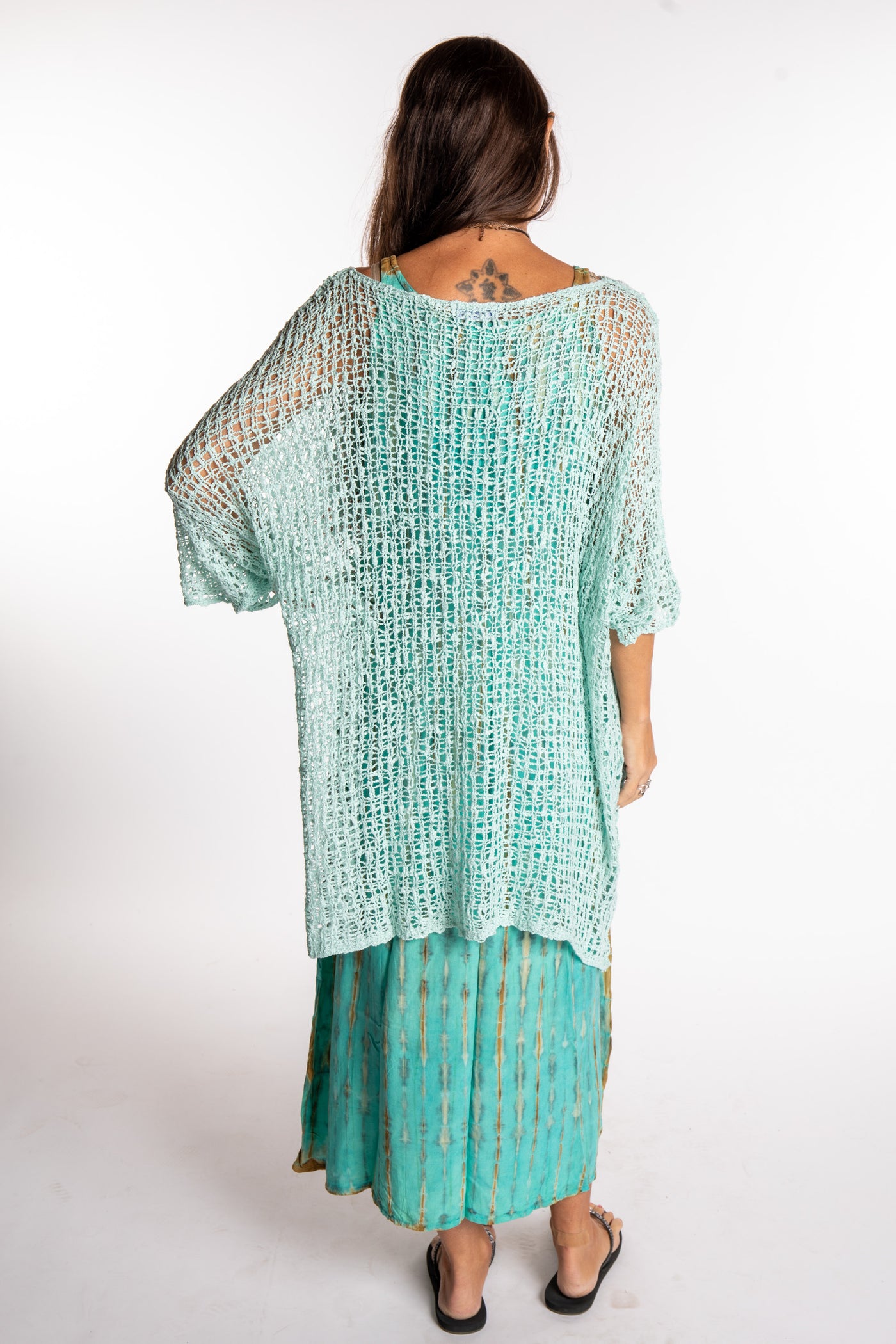 Jen is wearing the Seafoam loose knit cover up
