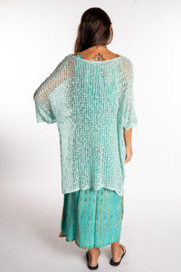 Jen is wearing the Seafoam loose knit cover up
