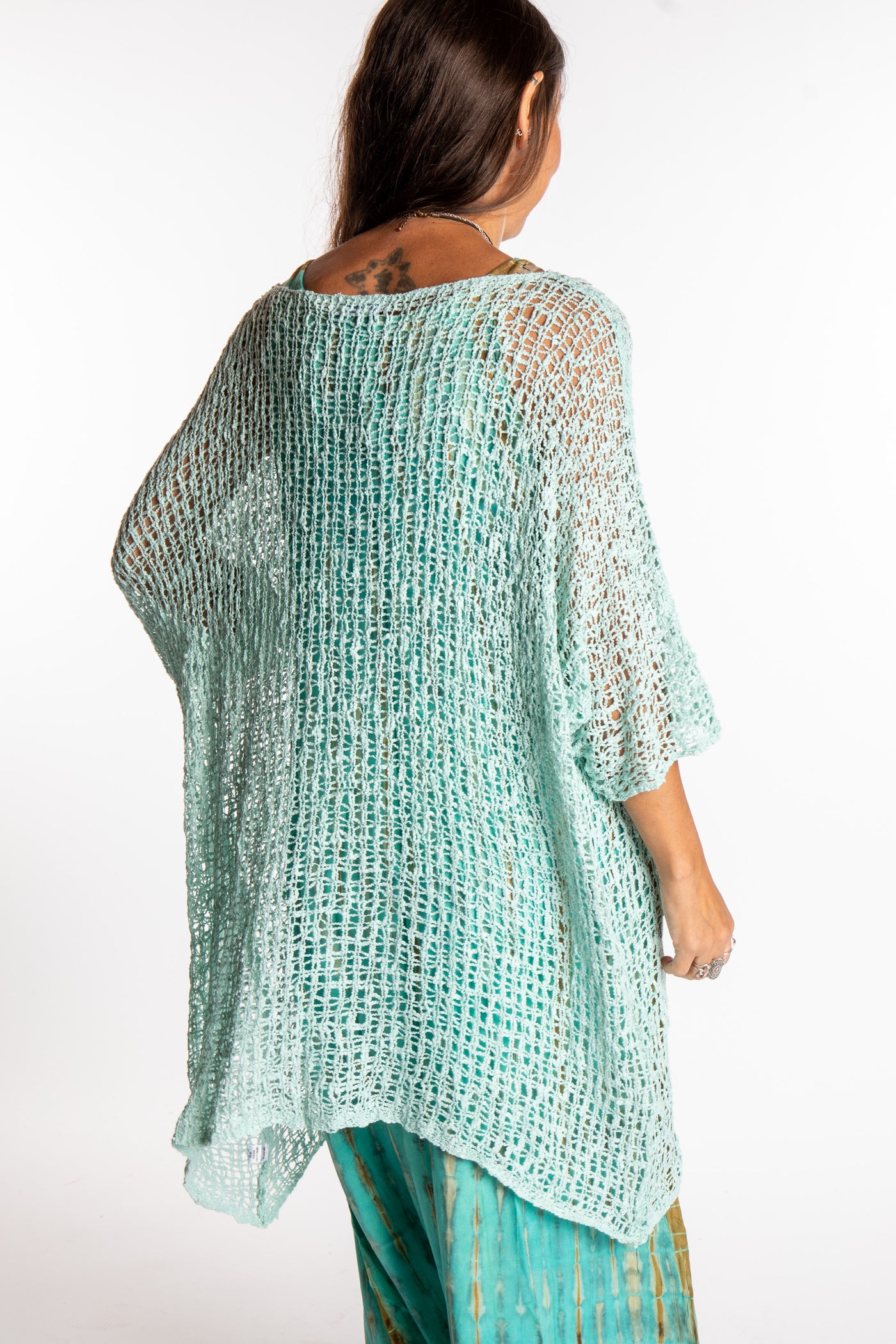 Jen is wearing the Seafoam loose knit cover up