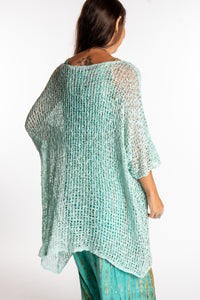 Jen is wearing the Seafoam loose knit cover up
