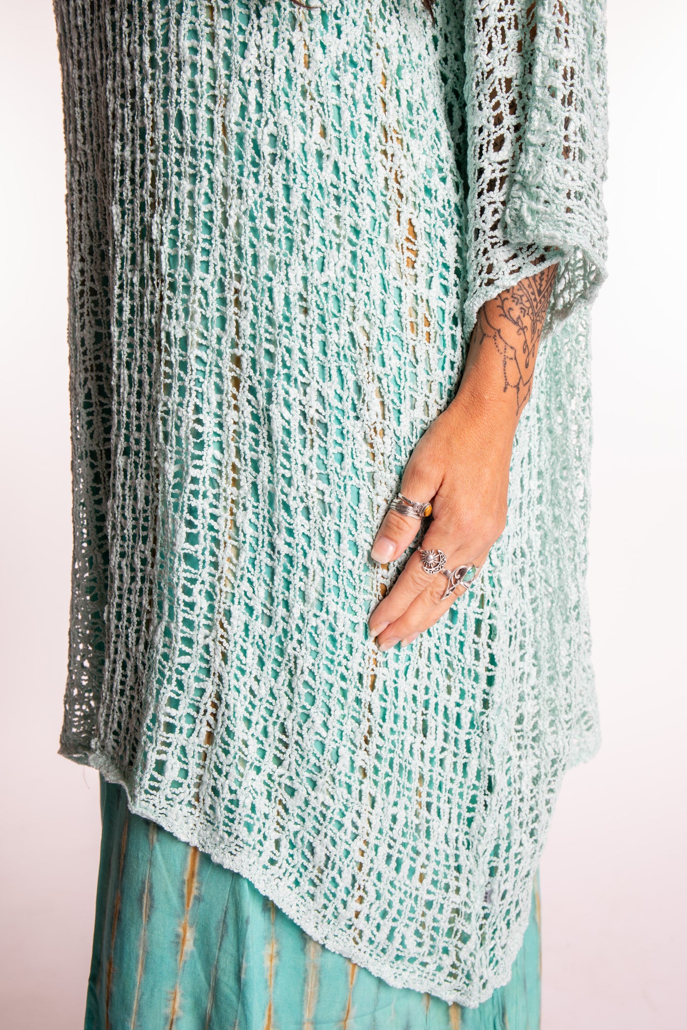 Jen is wearing the Seafoam loose knit cover up