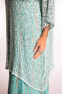 Jen is wearing the Seafoam loose knit cover up