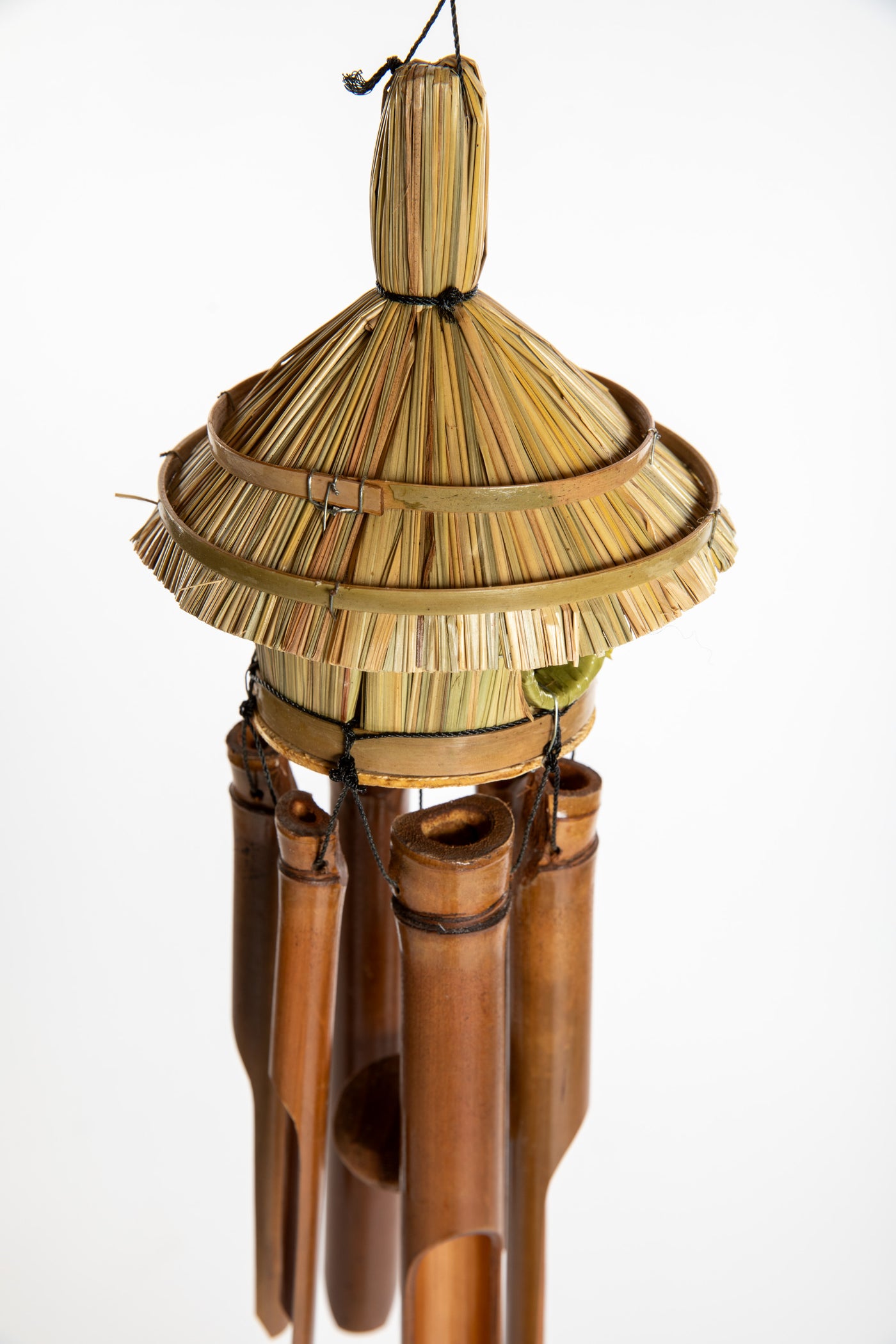 Bamboo wind chime with a thatched roof design