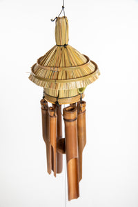 Bamboo wind chime with a thatched roof design