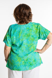 Betty is wearing a size Large batik tunic in Sky Blue Lime