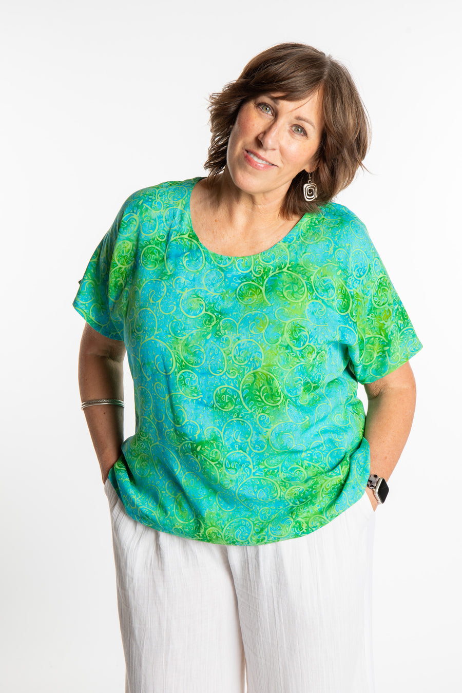 Betty is wearing a size Large batik tunic in Sky Blue Lime