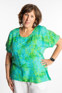 Betty is wearing a size Large batik tunic in Sky Blue Lime